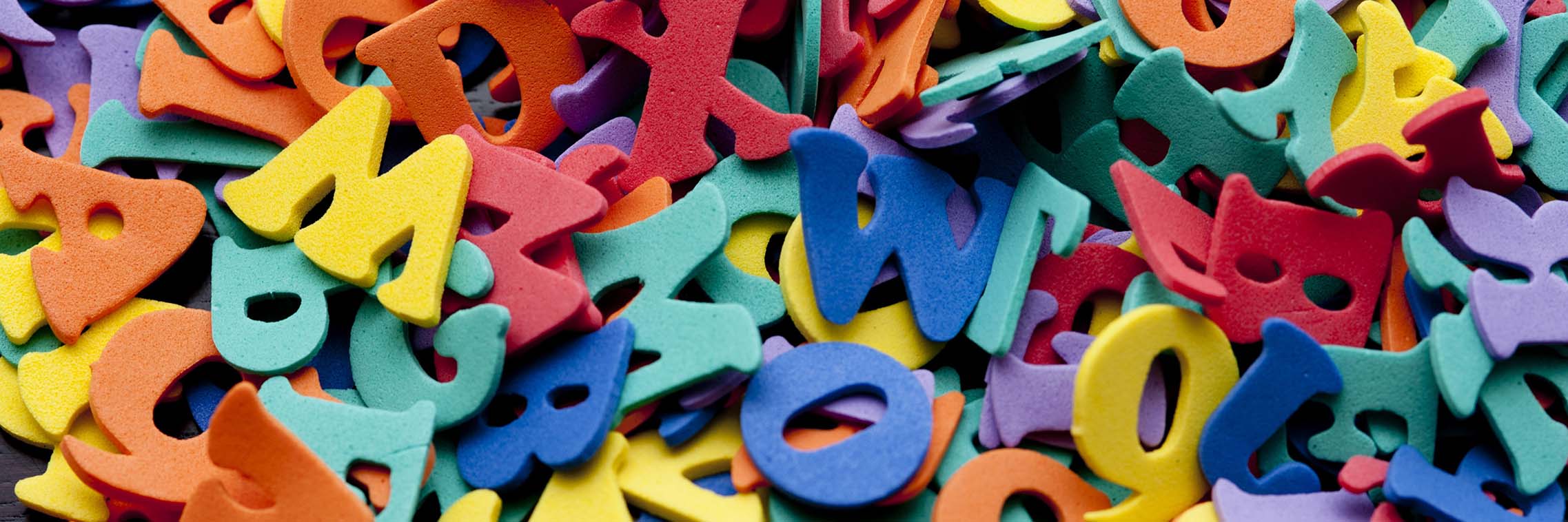 Random pile of colourful plastic letters